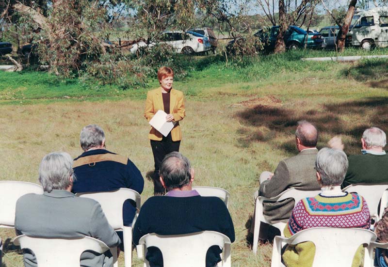 Lloyd Reserve Opening Members sitting on chairs, listening to Minister Ho. Judy Edwards MLA who is speaking.