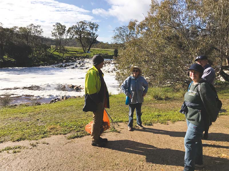 4 members enjoying a chat at the working bee at Extracts Weir